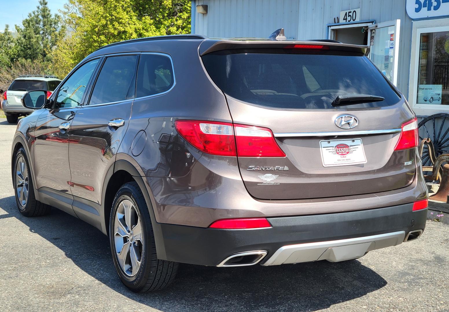 2015 Brown /Tan Hyundai Santa Fe GLS (KM8SMDHF7FU) with an 3.3L V6 engine, 6 Speed Auto transmission, located at 450 N Russell, Missoula, MT, 59801, (406) 543-6600, 46.874496, -114.017433 - Great Running AWD SUV. 3.3L V6 Engine. 6 Speed Automatic Transmission. 3rd Row Seating. Heated Front Seats. Power Drivers Seat. Backup Camera. AM FM XM CD. Bluetooth. Newer Continental Tires from Les Schwab. New Brakes. Air. Cruise. Tilt. Power Windows and Locks. - Photo#5